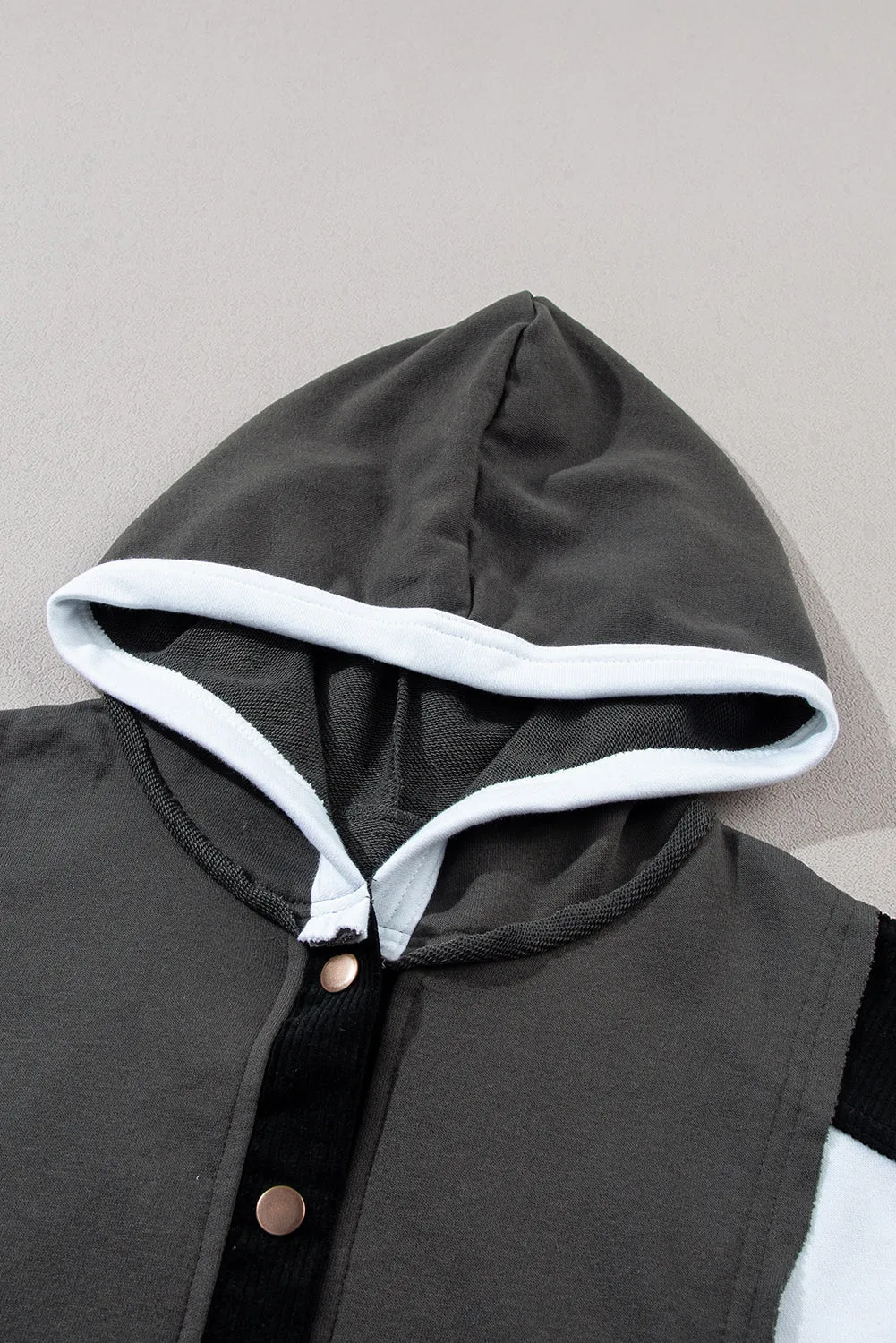 Black Color Block Exposed Seam Buttoned Neckline Hoodie